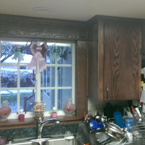 refaced cabinets and trimmed around window