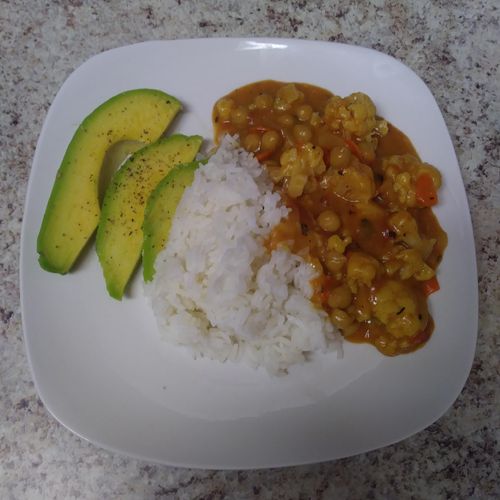Coconut curry chickpeas and califlower with a side