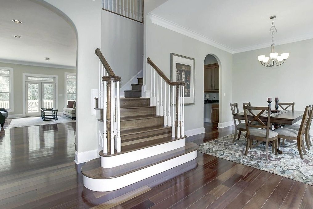A beautiful grand staircase just inside the entry 