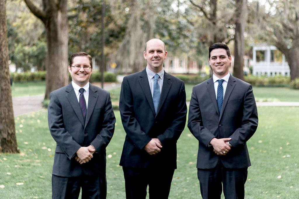 Attorneys Patrick Jarrett, Ben Price, and Trevor K