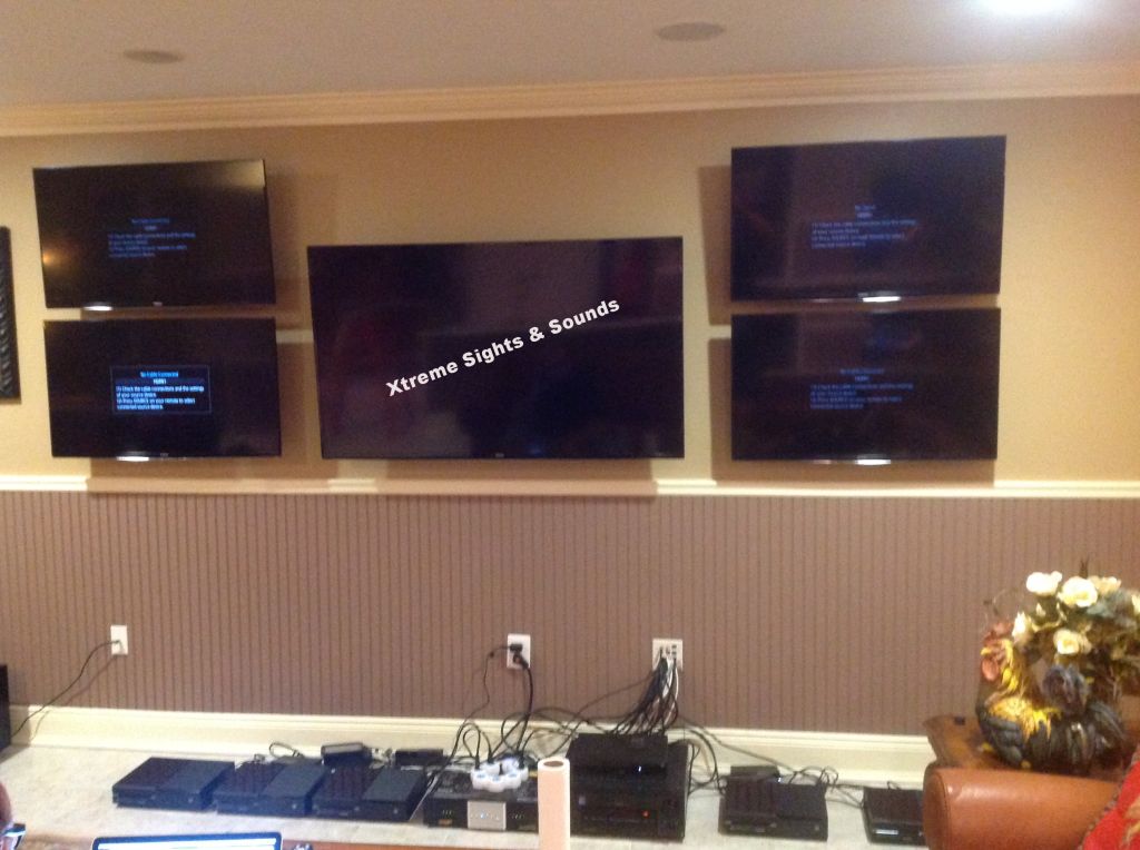 1 60" Samsung TV with 4 40" surrounding.  X-Box's 