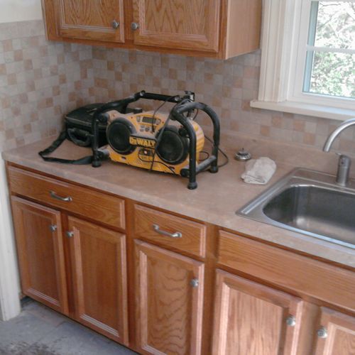 removed/replaced old cabs, counter tops, sink and 