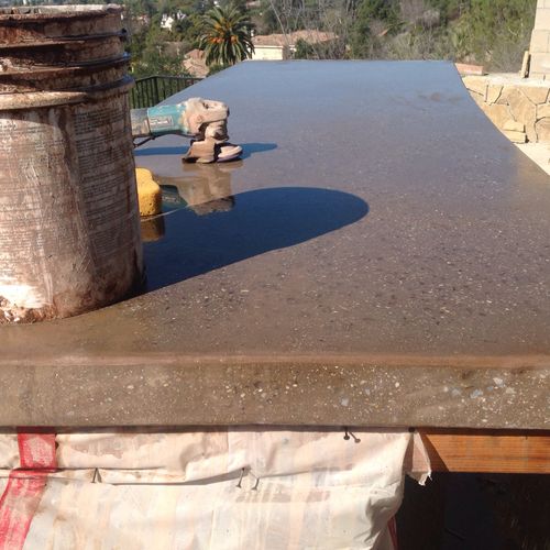 Polished concrete counter top with clear glass