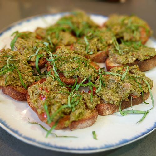 Crostini with green olive tapenade and mint