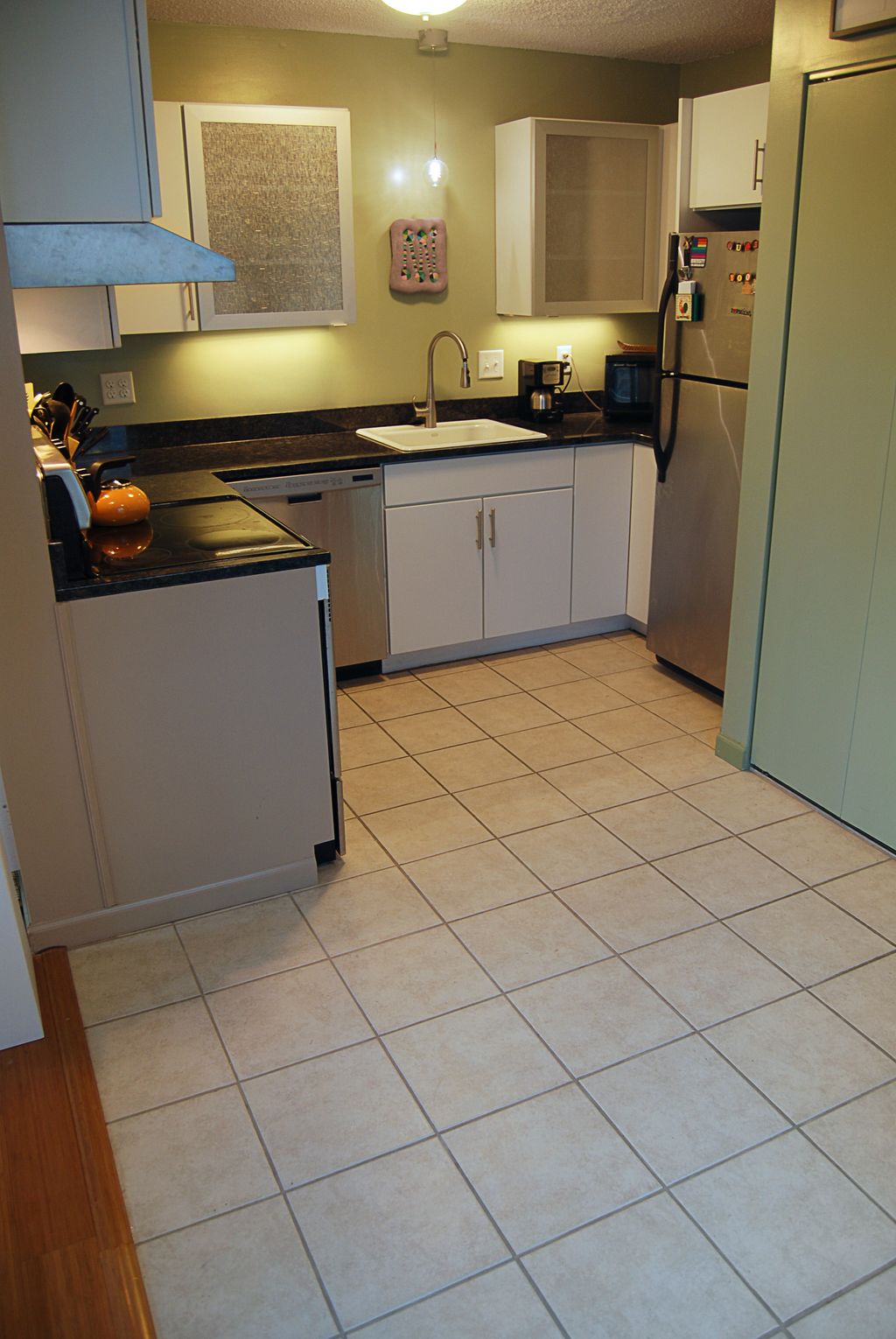 Kitchen remodeling; tile, glass accent wall cabine