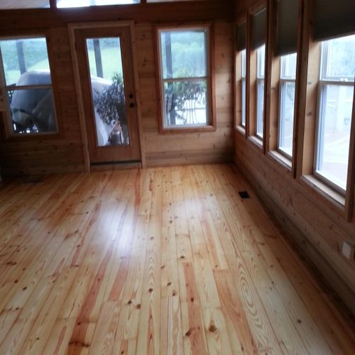 Sunroom with yellow pine flooring