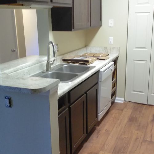 Installed new cabinets, countertops, dishwasher, s