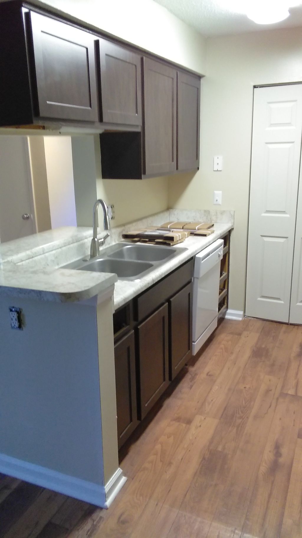 Installed new cabinets, countertops, dishwasher, s