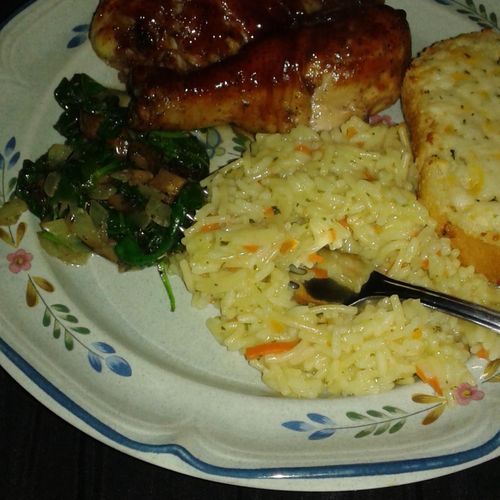 BBQ chicken served with rice pilaf and creamed spi