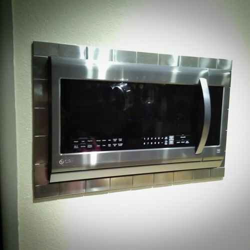In wall microwave with stainless steel clad porcel