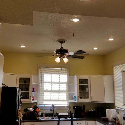 This kitchen was brighten up by adding can lights 