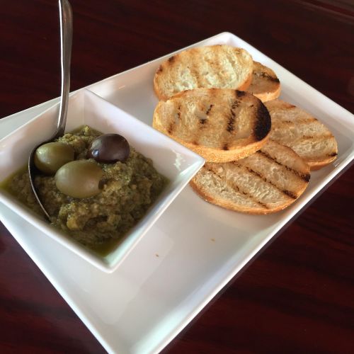 Olive tapenade and garlic rubbed crustinis 