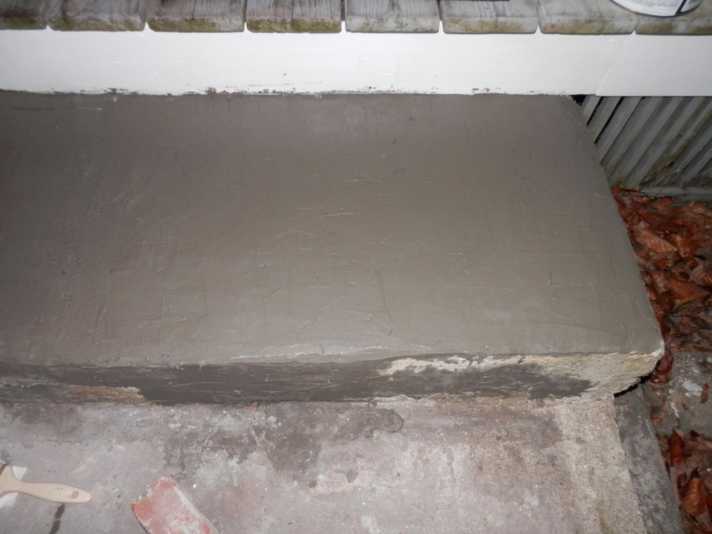 Holes are filled and top coat applied