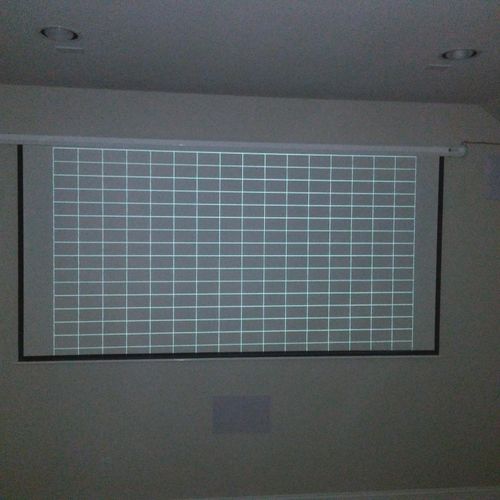 Projector screen installation with video calibrati