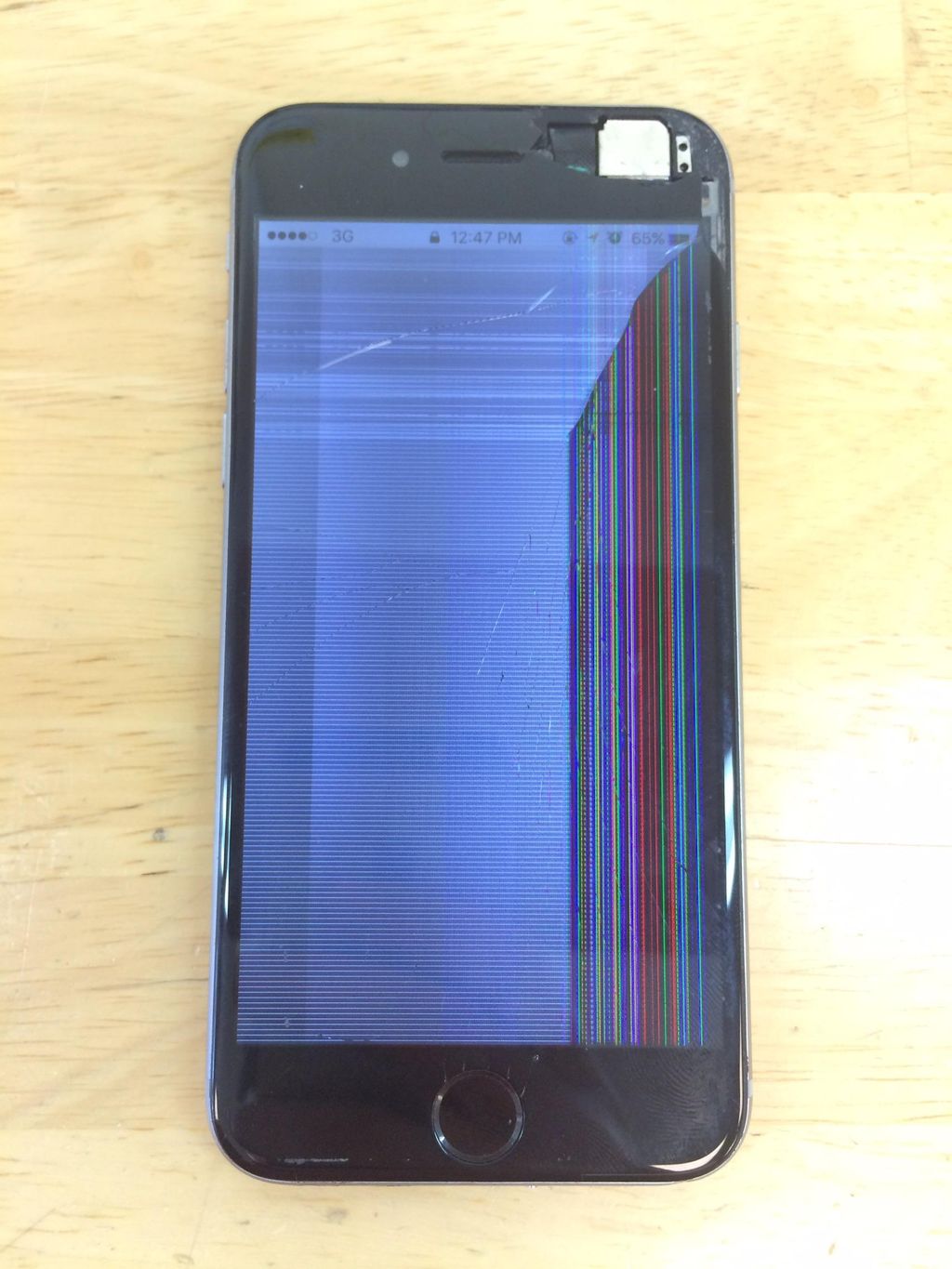 Apple iPhone with a broken glass and LCD panel.