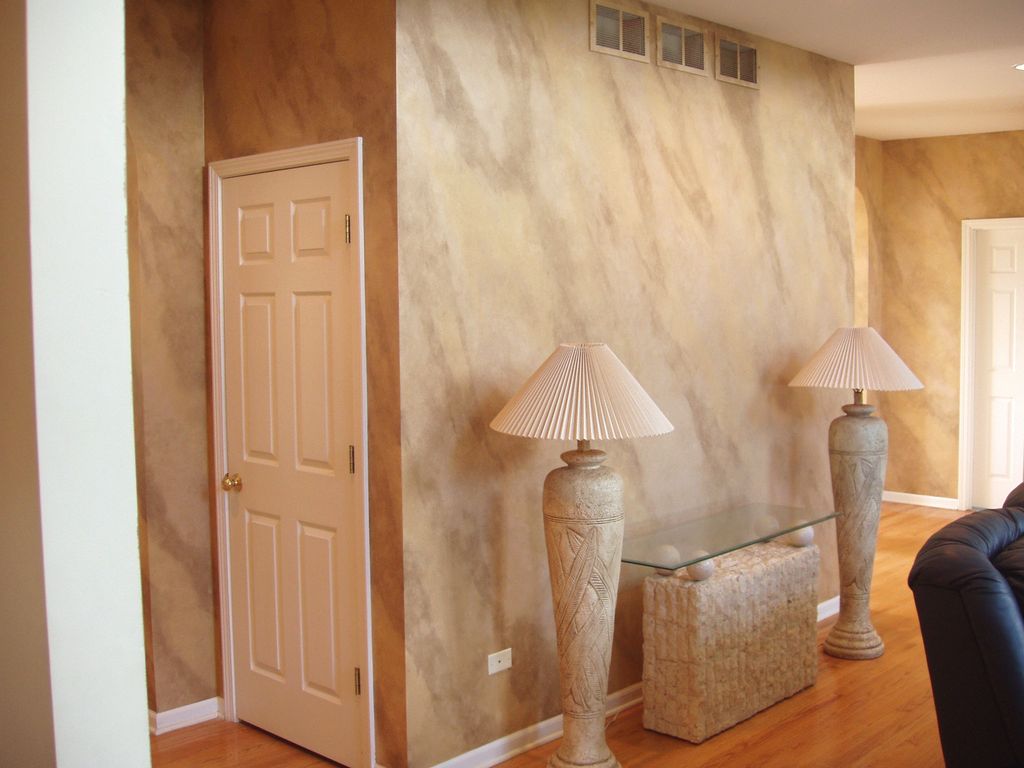Faux Marble Wall with Matching Painted Lamps.