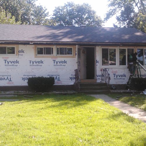 Single-story home exterior renovation: before.