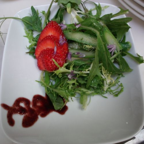 A simple dandelion green and frisee salad with str