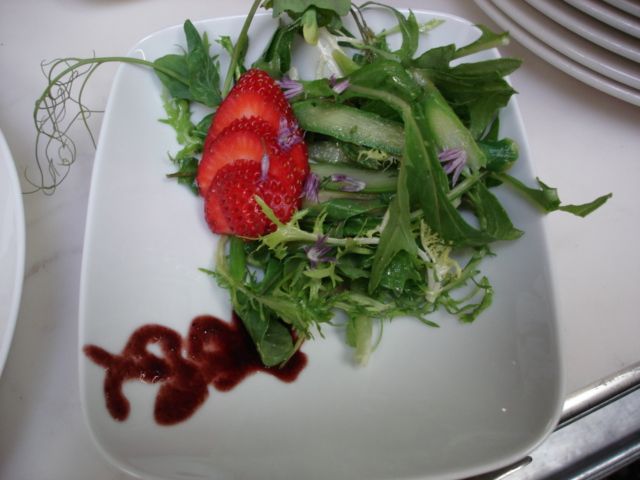 A simple dandelion green and frisee salad with str