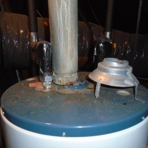 Water heater exhaust flue is installed improperly.