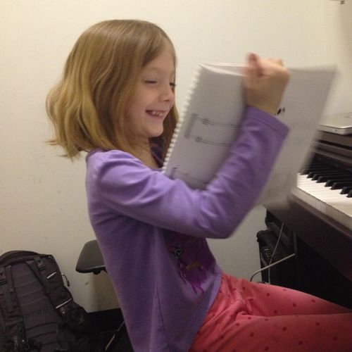 Sadie having fun with her Piano Explorer's songs