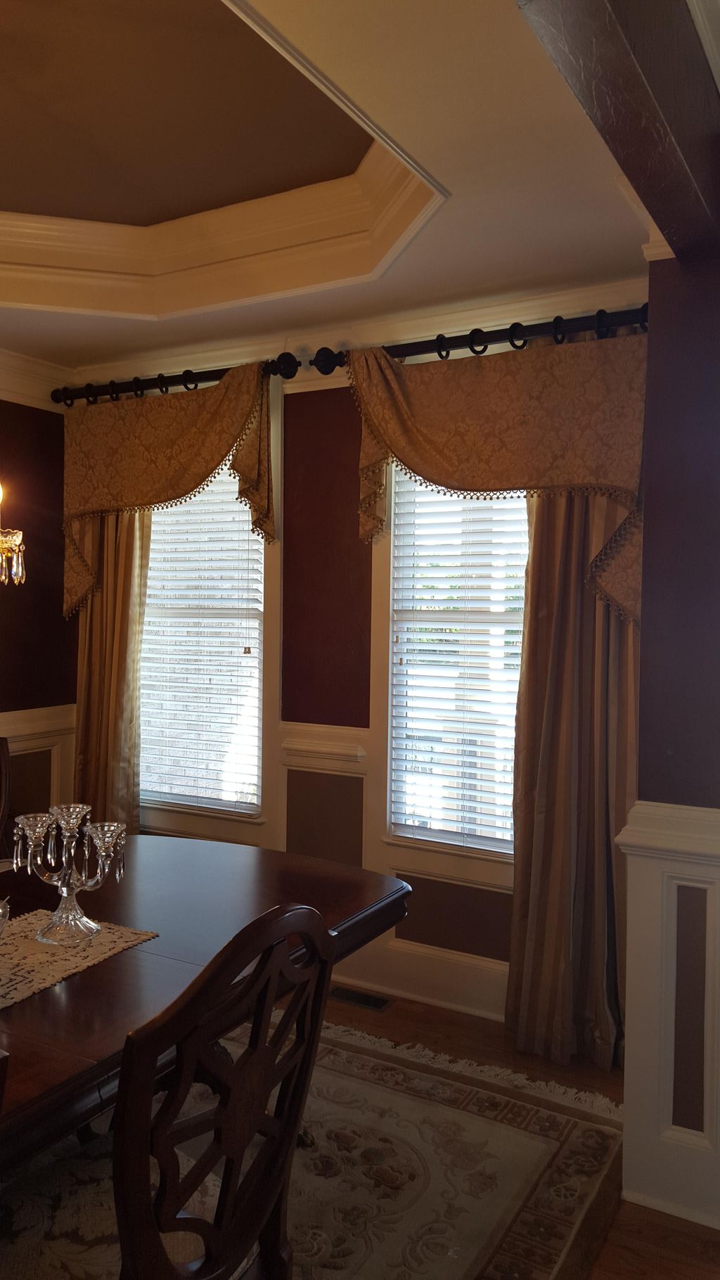 Asymmetric valance on a pole over a pleated panel 