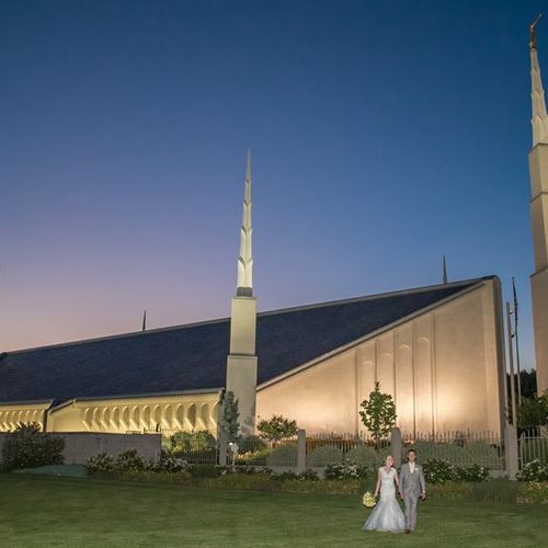 Couple in front of the LDS Boise Temple in the eve