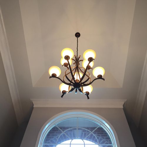 Custom built-up crown molding in two-story foyer