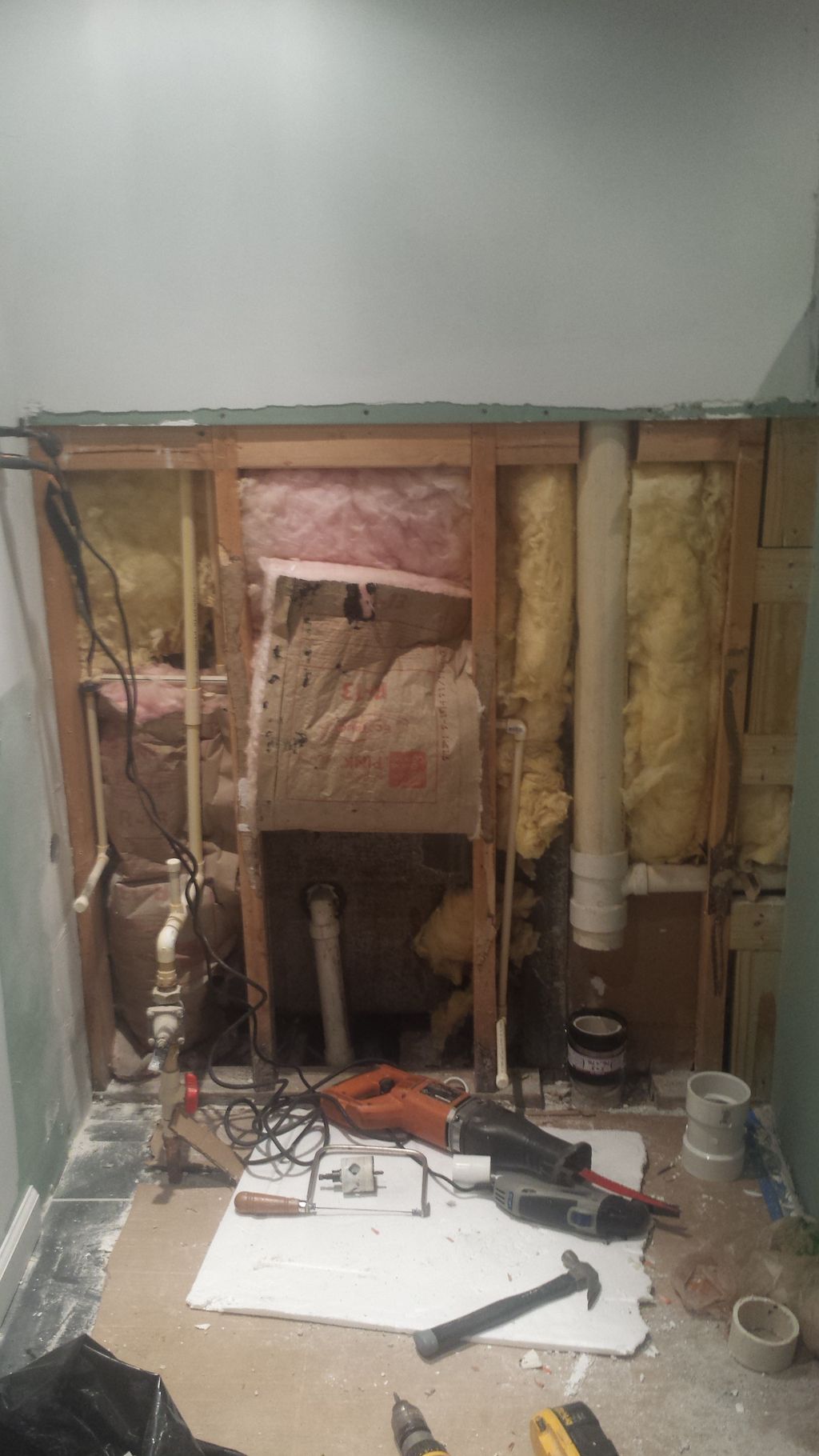 here we opened up the wall to run drain pipe for a