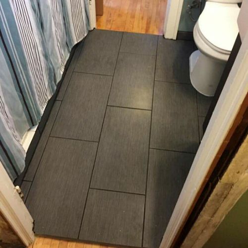 Bathroom floor. Water damage. Pre-existing tile re