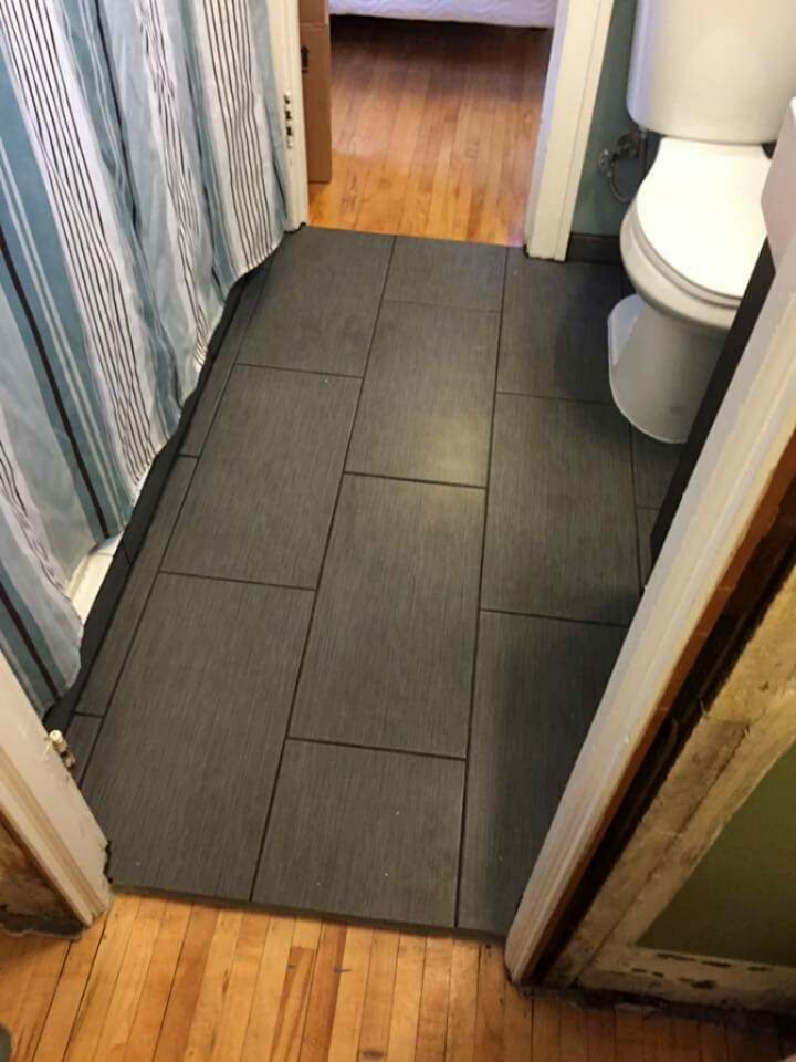 Bathroom floor. Water damage. Pre-existing tile re
