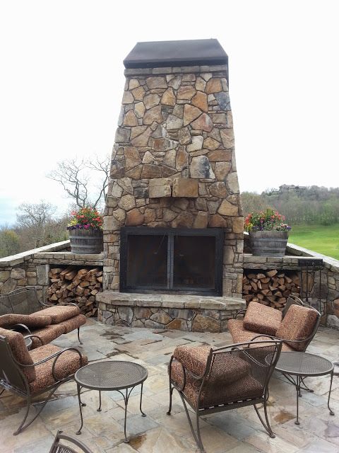 Outdoor fireplace with wood storage
