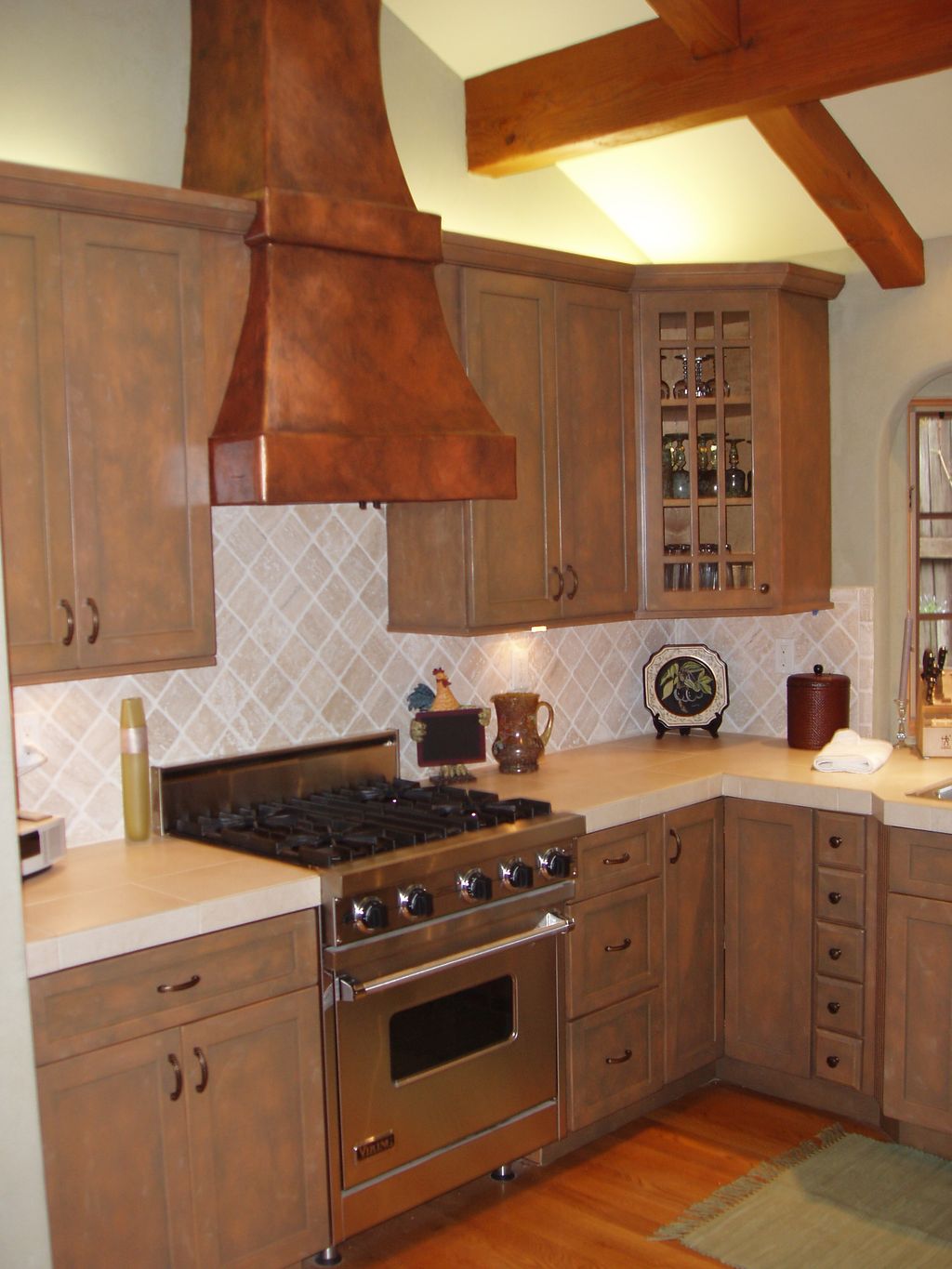 Repainted and aged kitchen cabinets and a metalic 