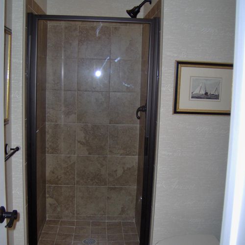 Custom Tile Shower with Fitted Glass Door.