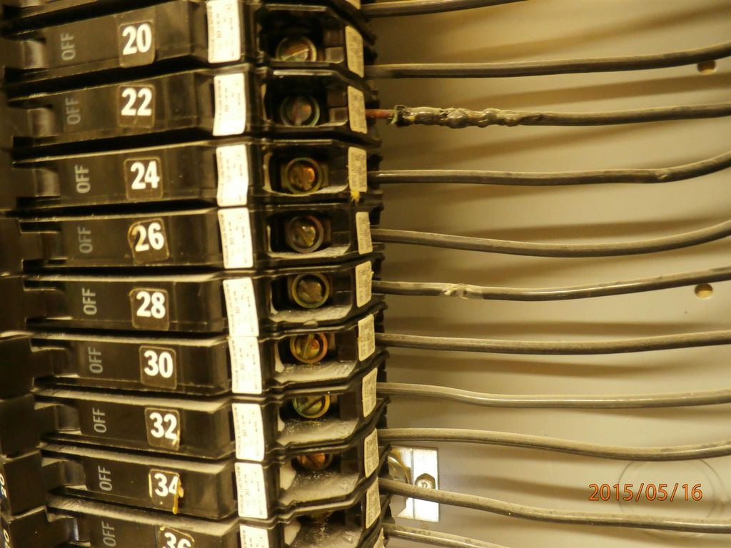 Removing the cover to the electrical panel, discov