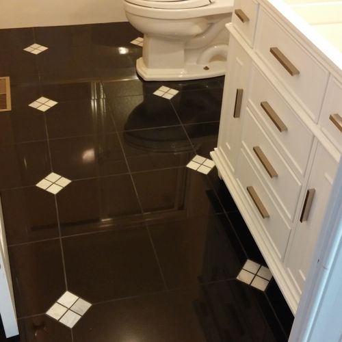 Granite tile with marble inlays
