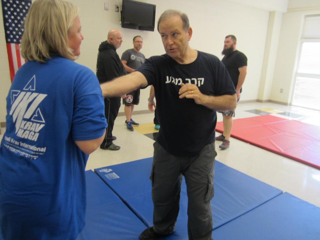 Showing a student how to defend herself against so
