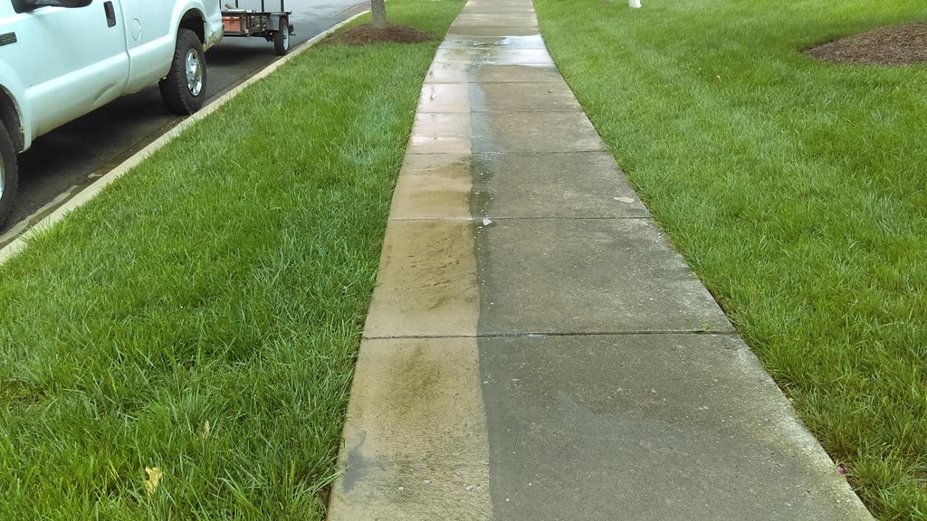 Washing a dirty sidewalk (during)
