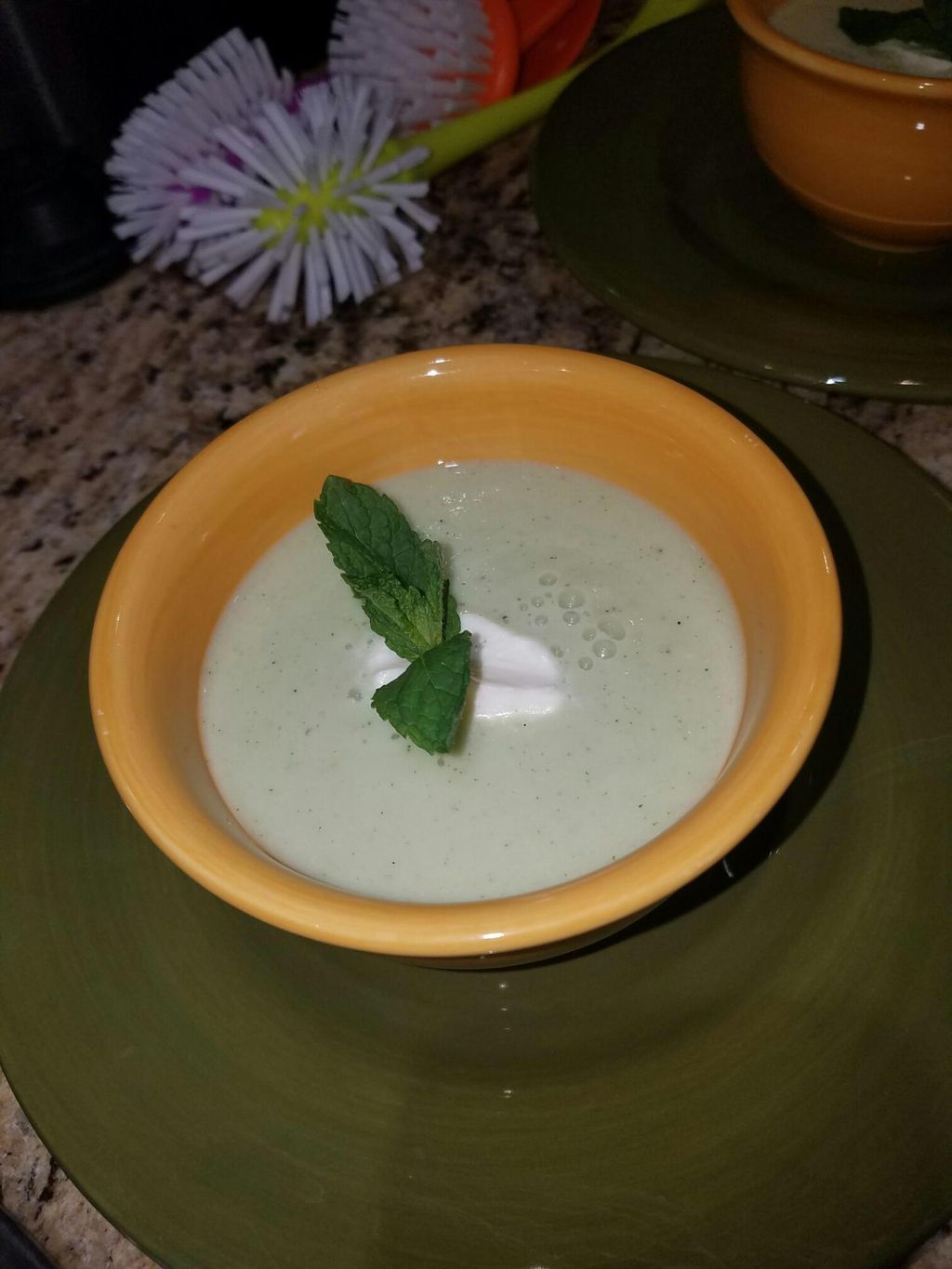Chilled cucumber soup with goat cheese and mint