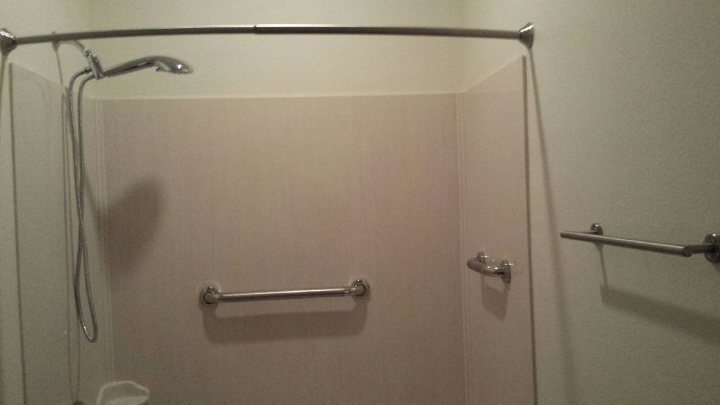 Installed new shower head, curved shower rod, towe