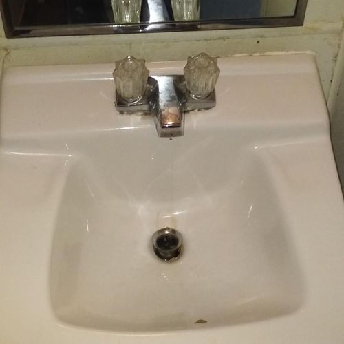Bathroom sink pulled from wall.