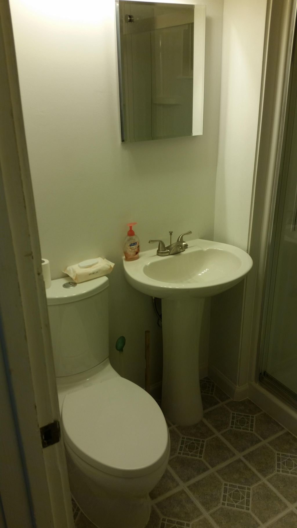 After- Toilet, Sink, new Medicine cabinet w/overhe