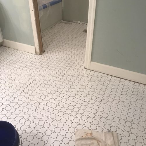 Installed tiled floor replaced toilet 