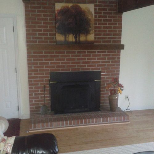 fire place in room with bamboo flooring