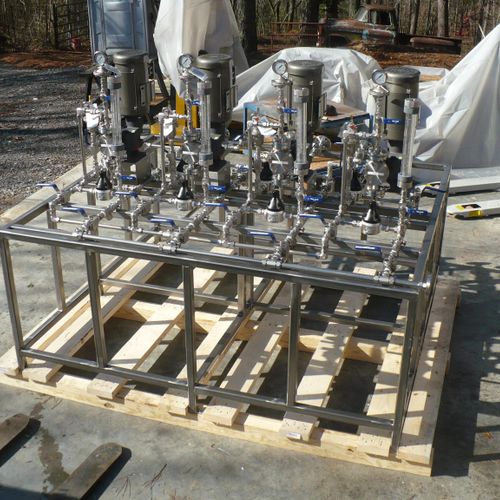Four pump stainless steel methanol pump skid fabri