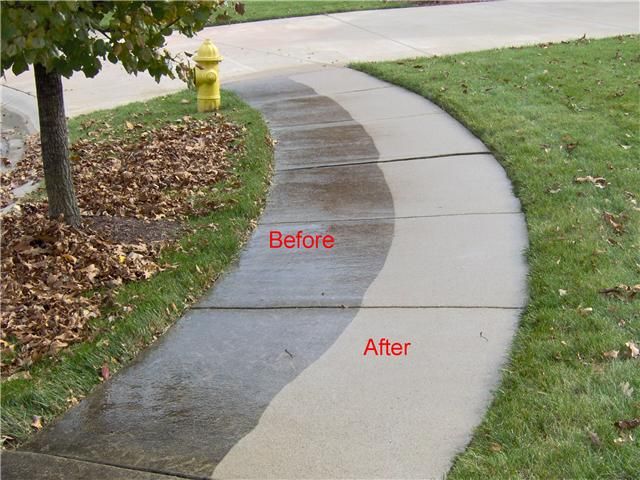 Pressure washing on a front sidewalk.