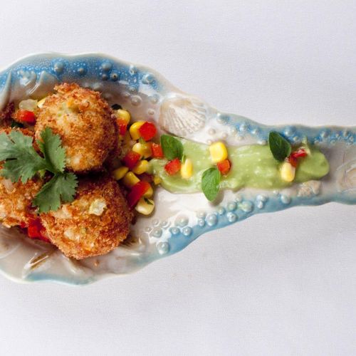 Mini Crab cakes abed a roasted corn relish with a 