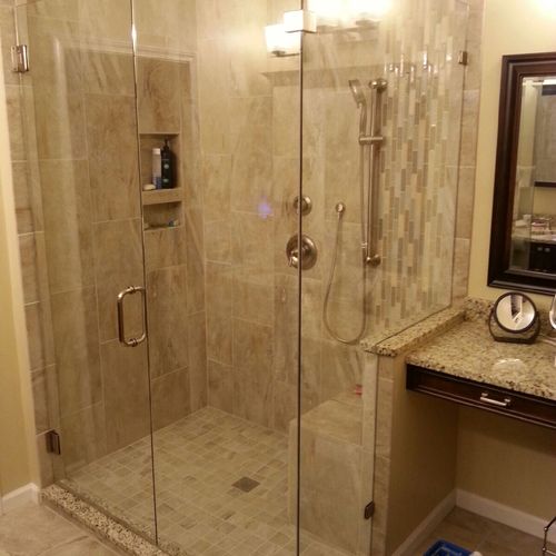 Custom shower with 12"x24" tiles installed vertica