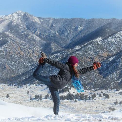 Dancer pose on the snowy Sand Dunes, CO
