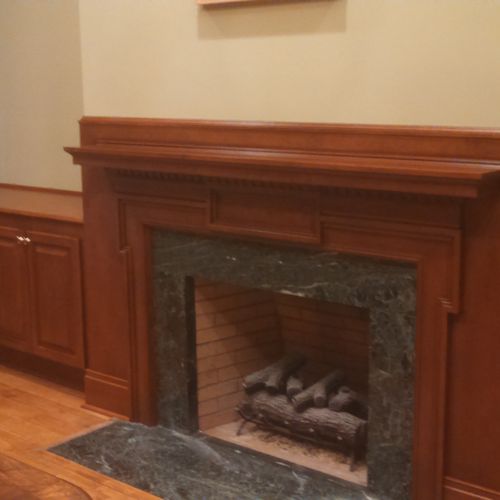 Custom fireplace mantel/surround and cabinetry